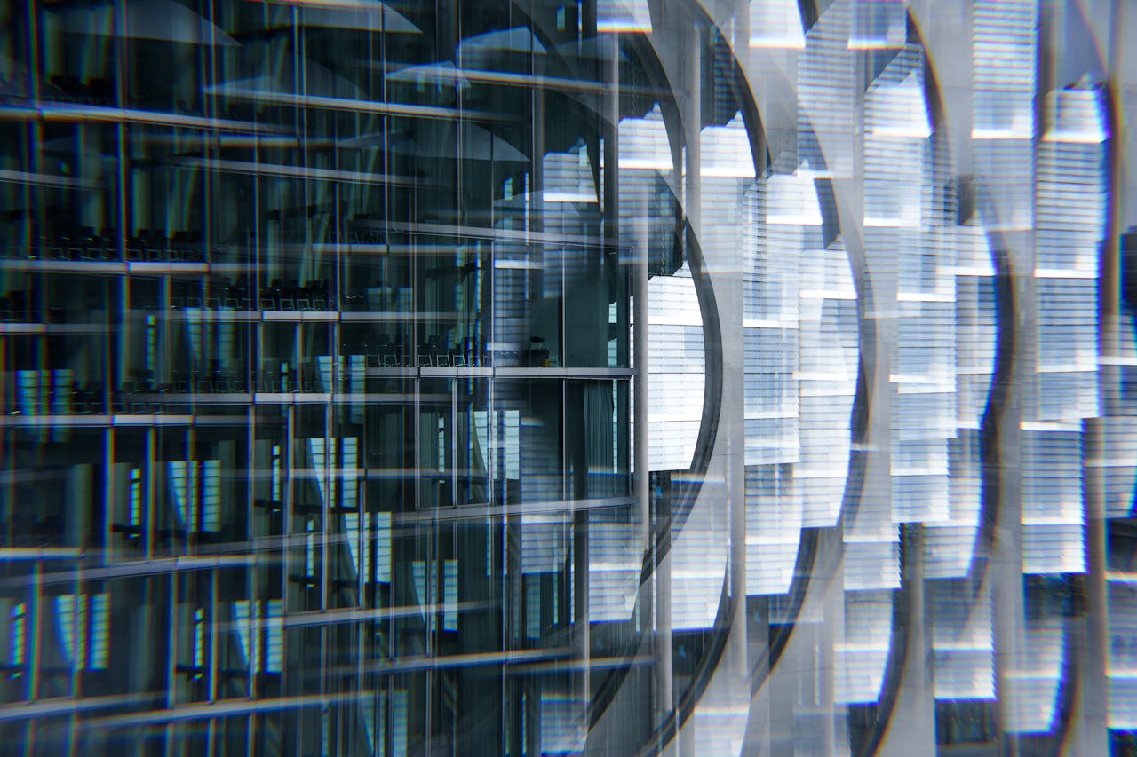 Abstract view of a modern skyscraper with glass reflections creating a futuristic urban look.